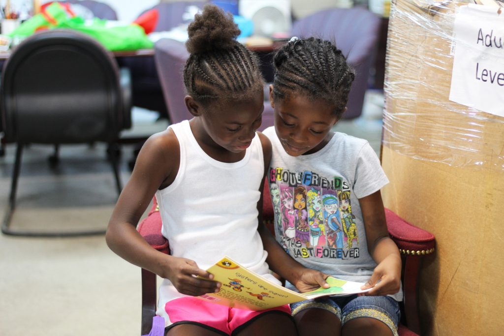 Cleveland Kids' Book Bank photo of two girls reading a book together