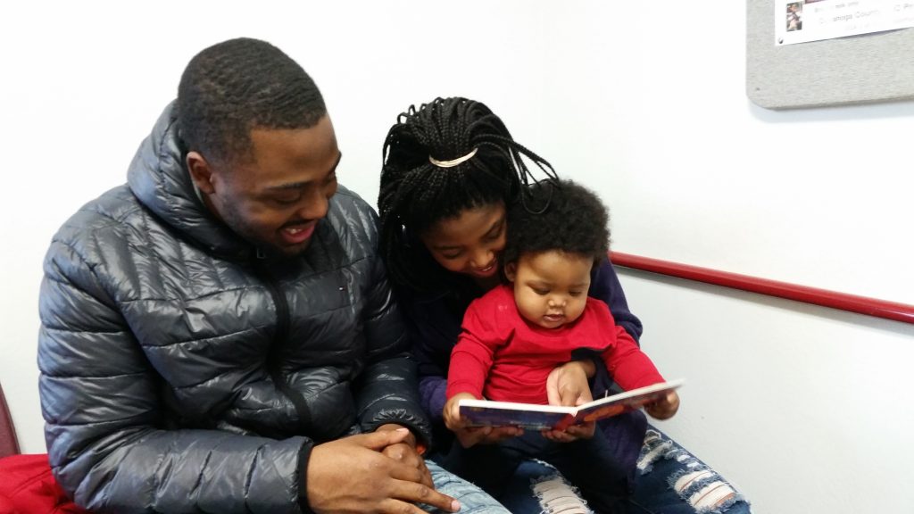 Cleveland Kids' Book Bank picture of a family reading together