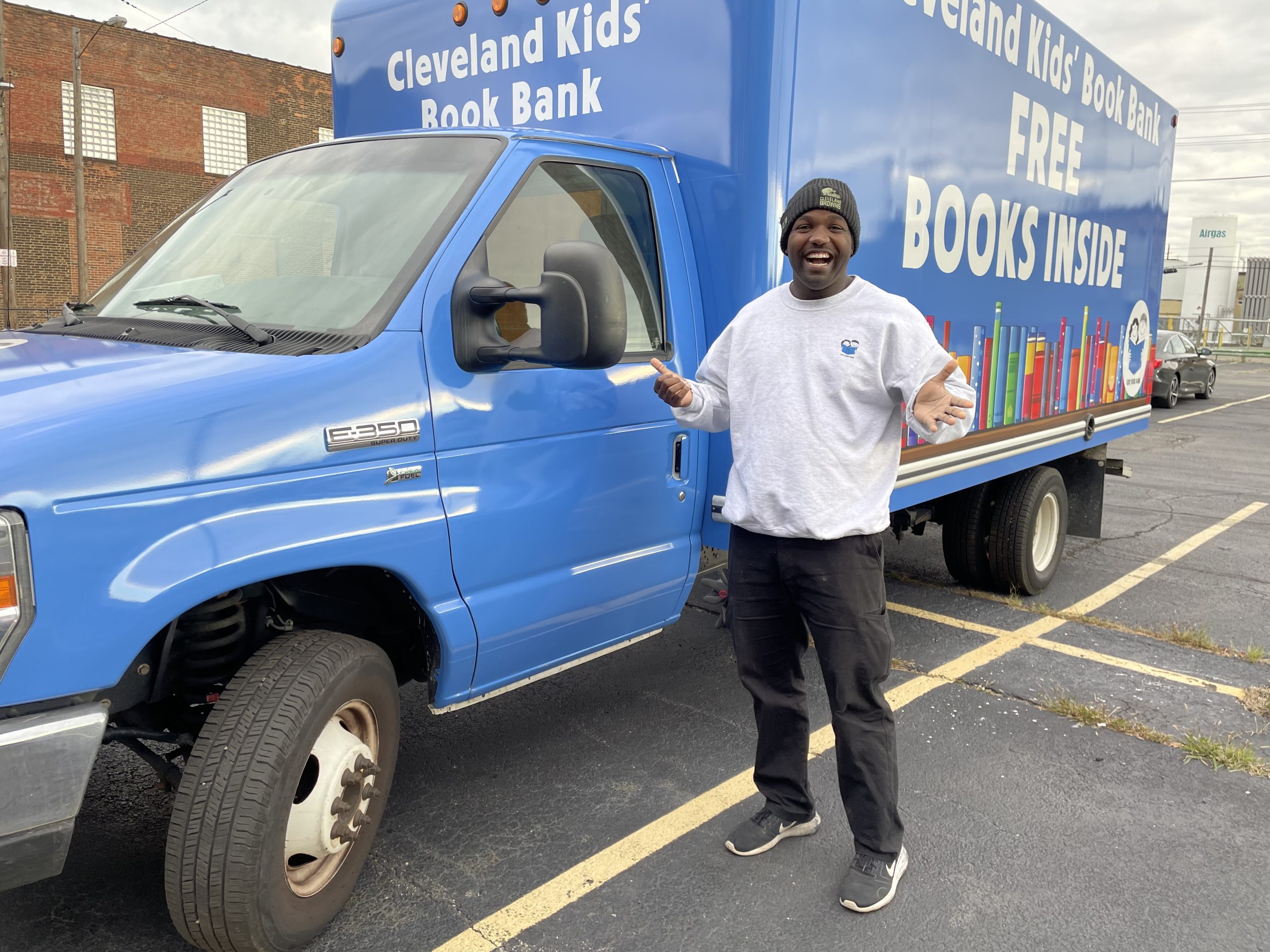 Angelo-truck-Nov21 Angelo standing next to Cleveland Kids' Book Bank truck