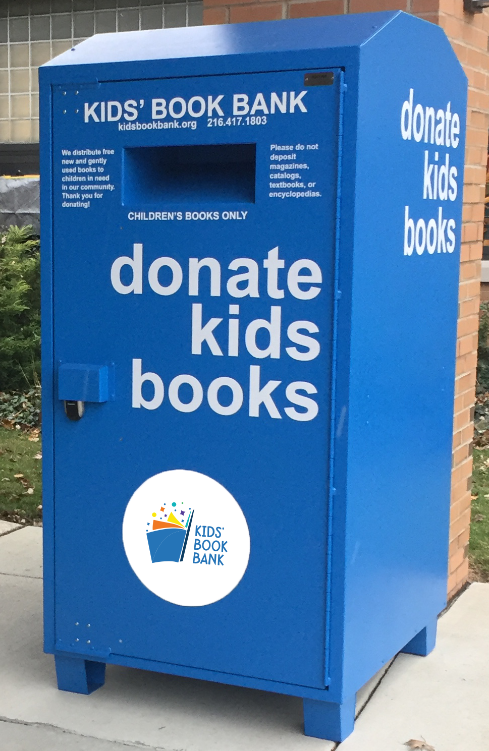 BookBinNewLogo photo of large steel blue bin with Kids' Book Bank logo