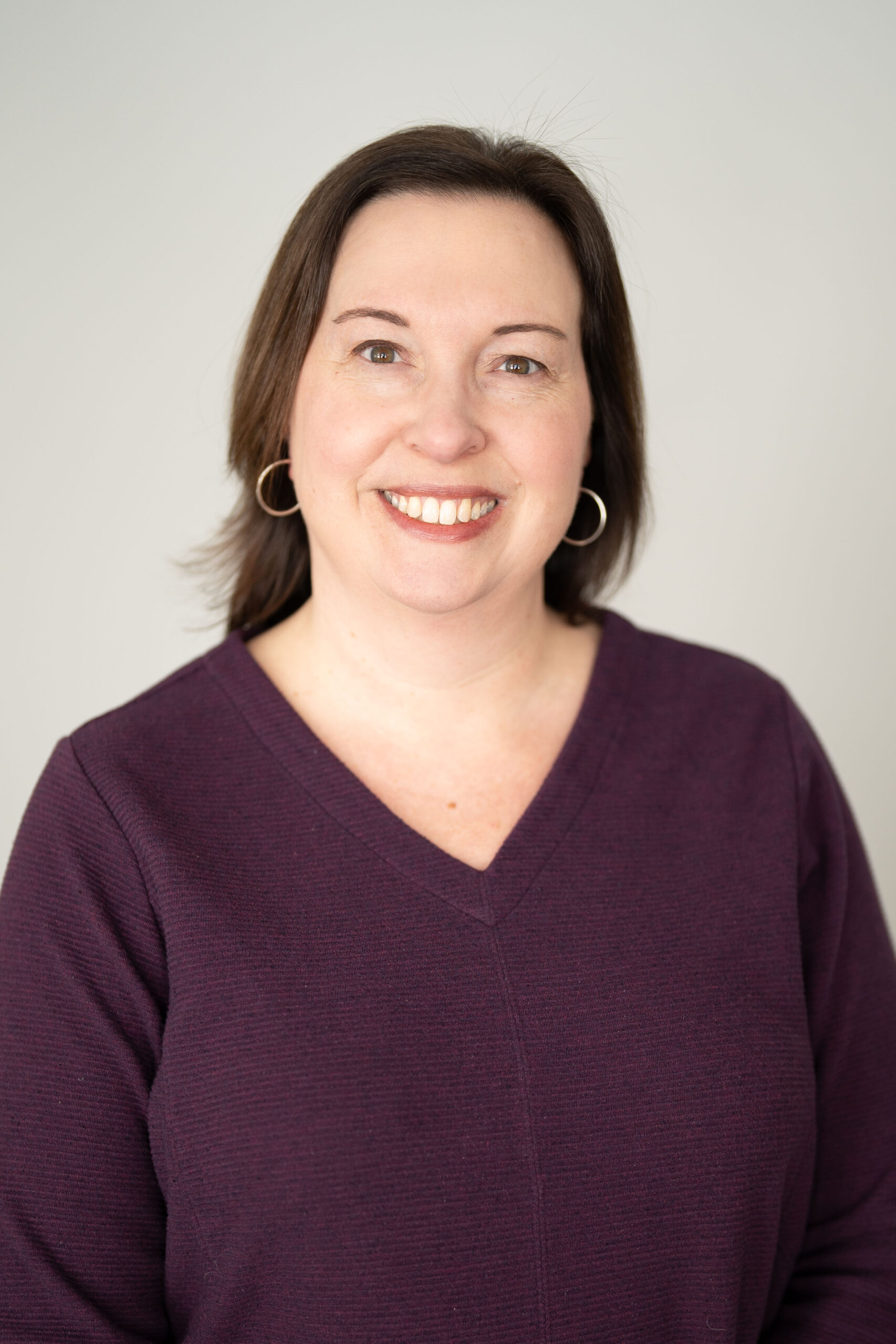 smiling woman with dark hair